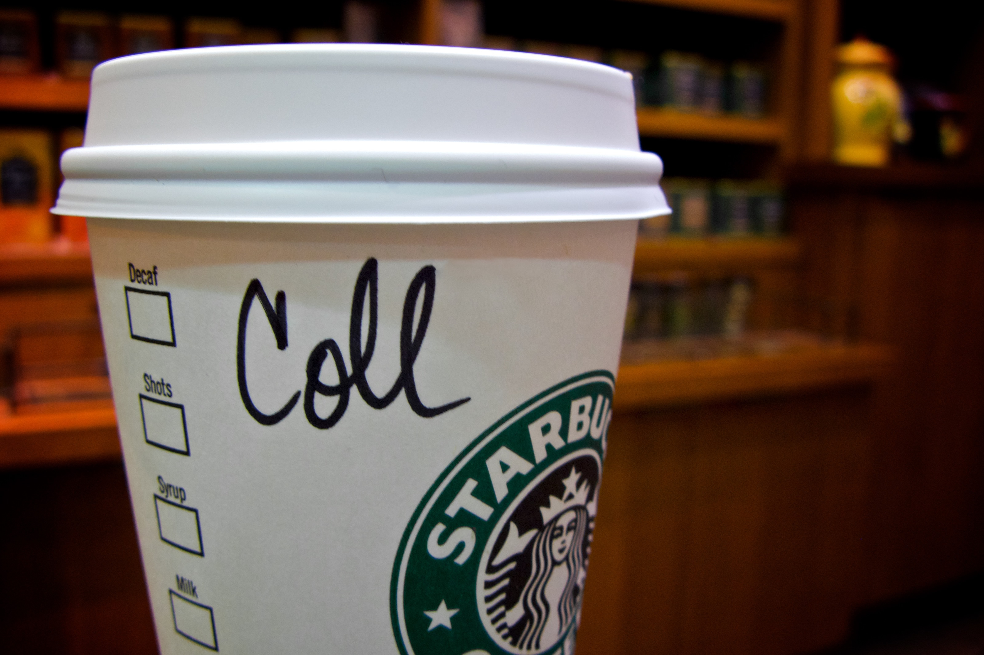 'Coll' written on the side of a Starbucks cup
